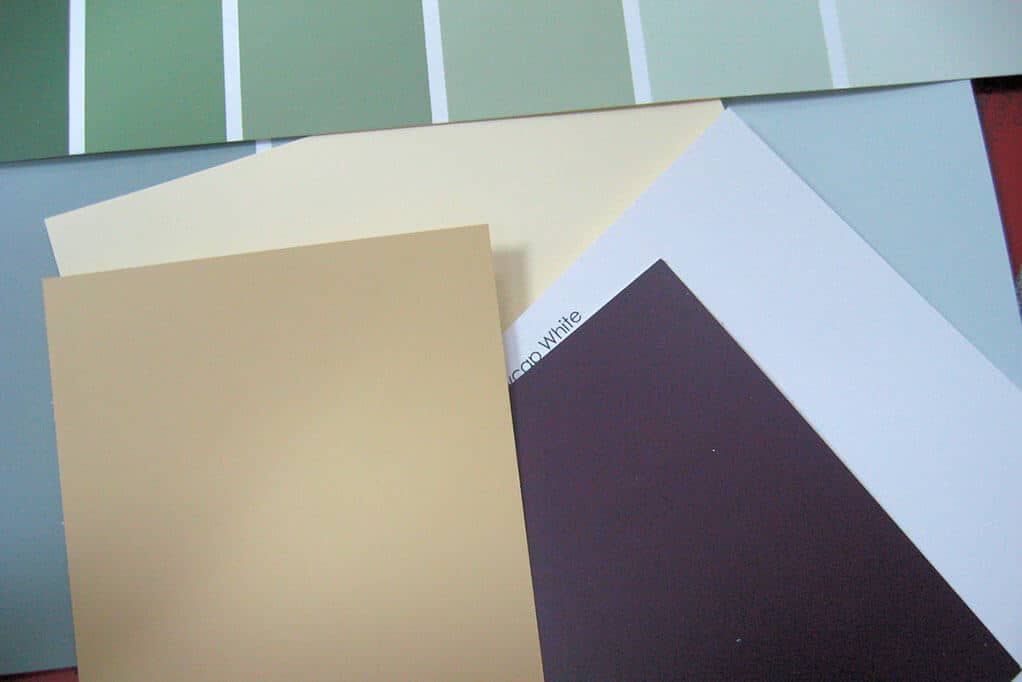 RGBA opacity. different green, yellow, and purple paint swatches in a pile