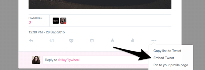 arrow pointing to the Embed Tweet option in Twitter