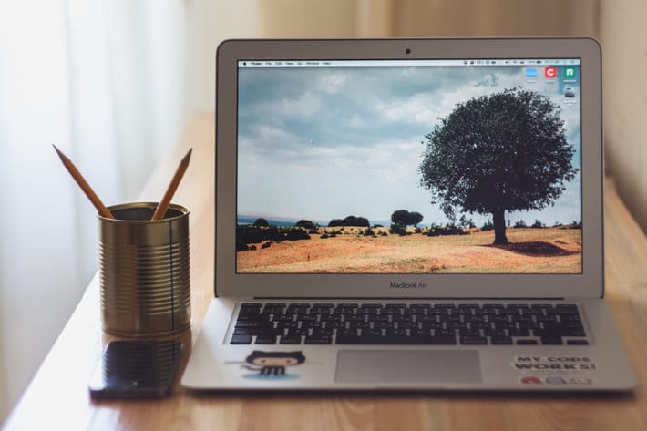 a laptop open on a table 