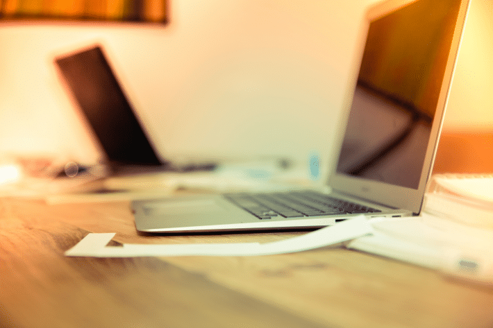 a laptop on a wooden desk