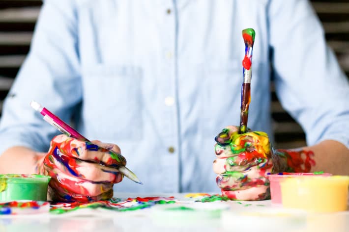 Person with paint on their hands