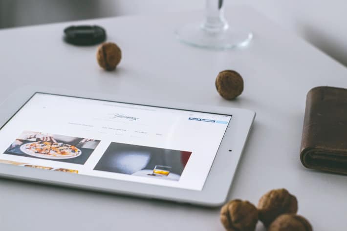 a tablet sits on a white table